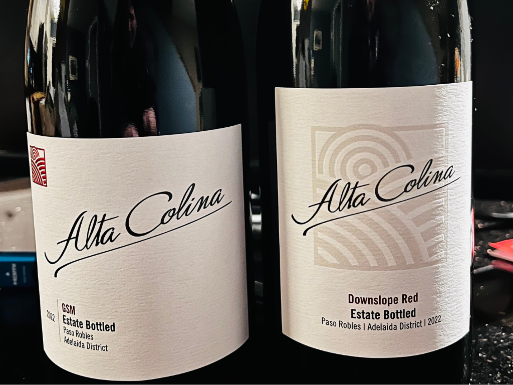 a bottle of Alta Colina GSM and Downslope Red