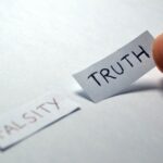falsity vs truth. two words